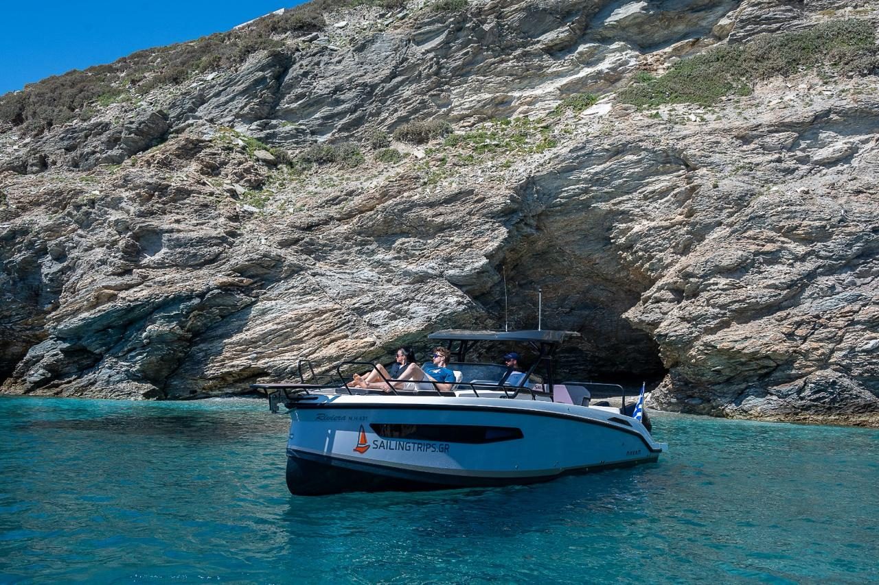 Motor yacht at a sea cave on the Hidden Caves & Beaches trip, Crete